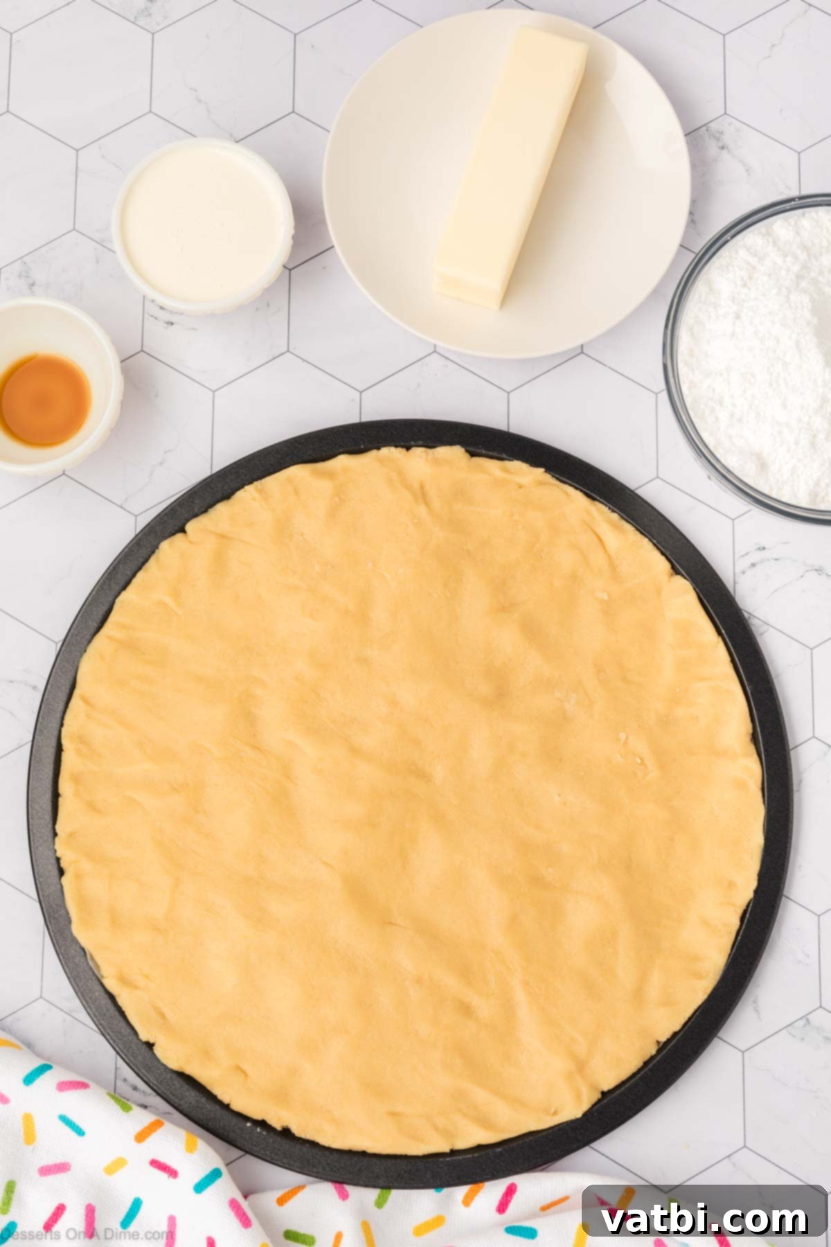 Perfect Sugar Cookie Cake 9 Dough pressed into cake pan.