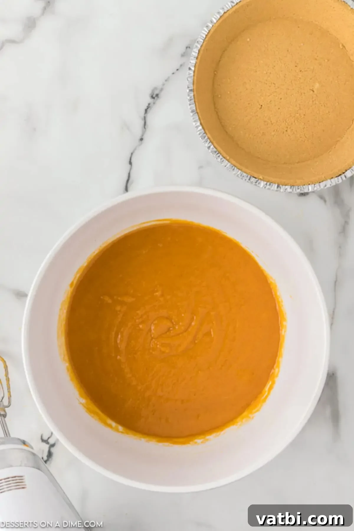 Homemade Sweet Potato Pie Perfection 5 Pie filling combined in a bowl.