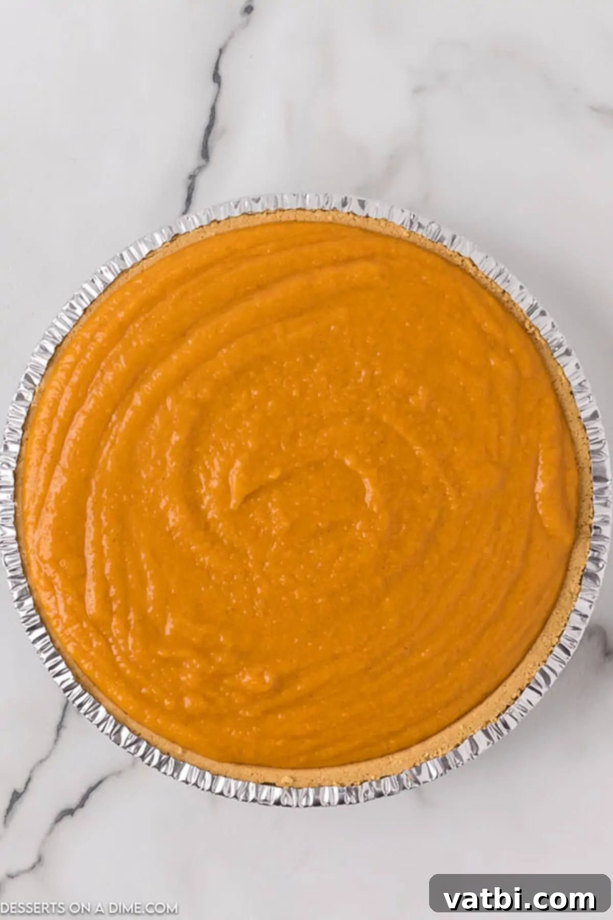 Homemade Sweet Potato Pie Perfection 6 Pie filling poured into pie crust.