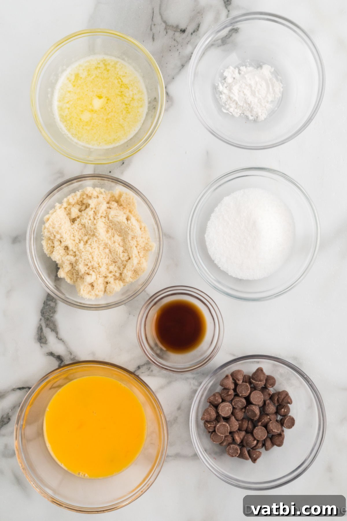 Guilt-Free Keto Chocolate Chip Mug Cake 3 Ingredients for keto mug cake including butter, almond flour, Swerve sweetener, and sugar-free chocolate chips.