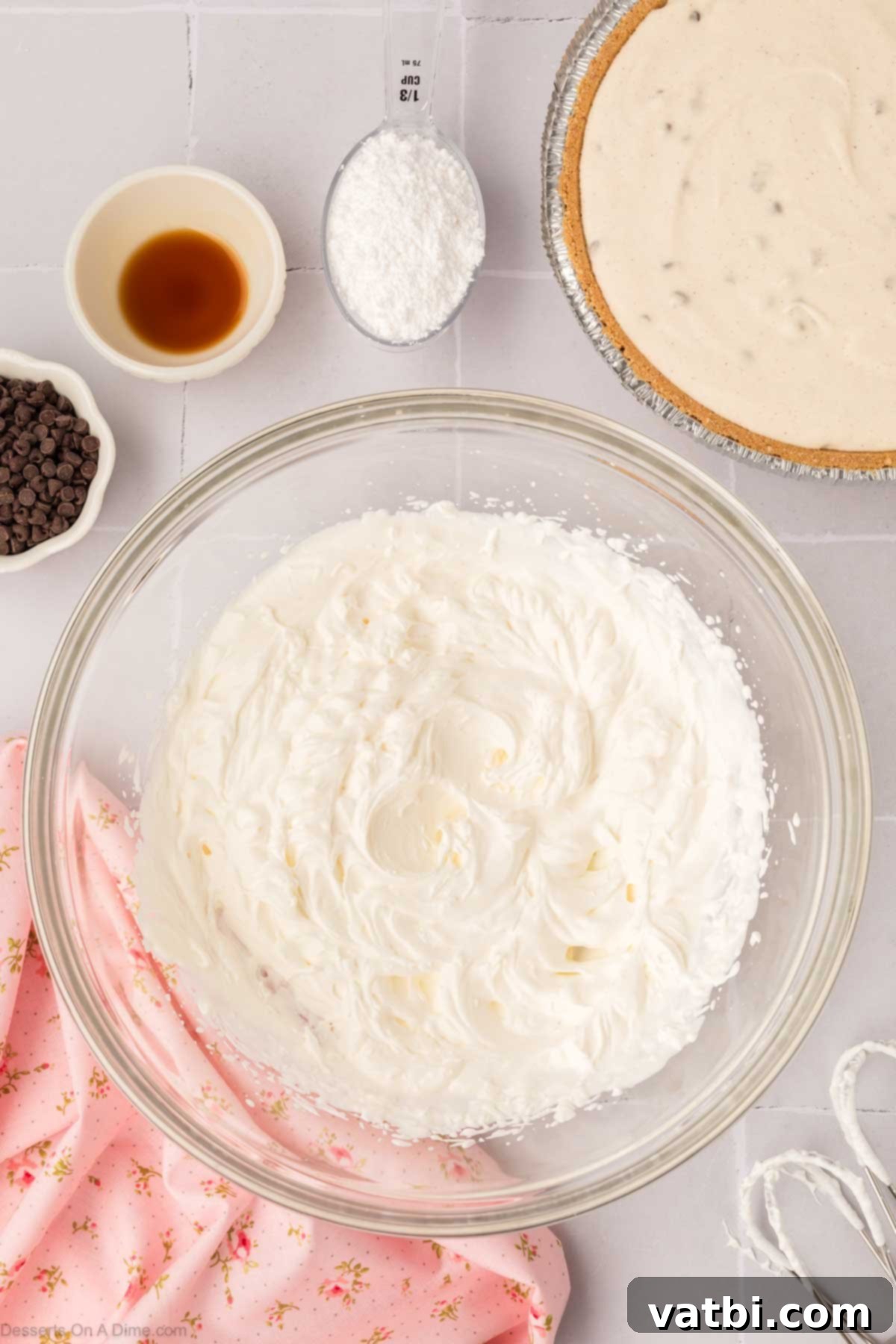 Decadent Cannoli Pie 9 Heavy whipping cream being beaten until stiff peaks form, ready for the pie topping.