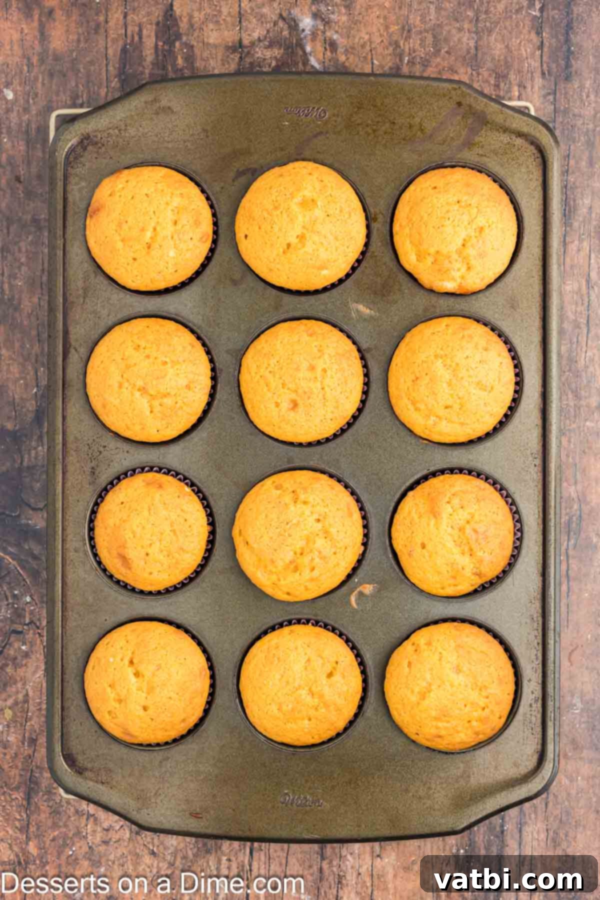 Magical Harry Potter Cupcakes 6 Freshly baked cupcakes cooling in the muffin pan on a wire rack.