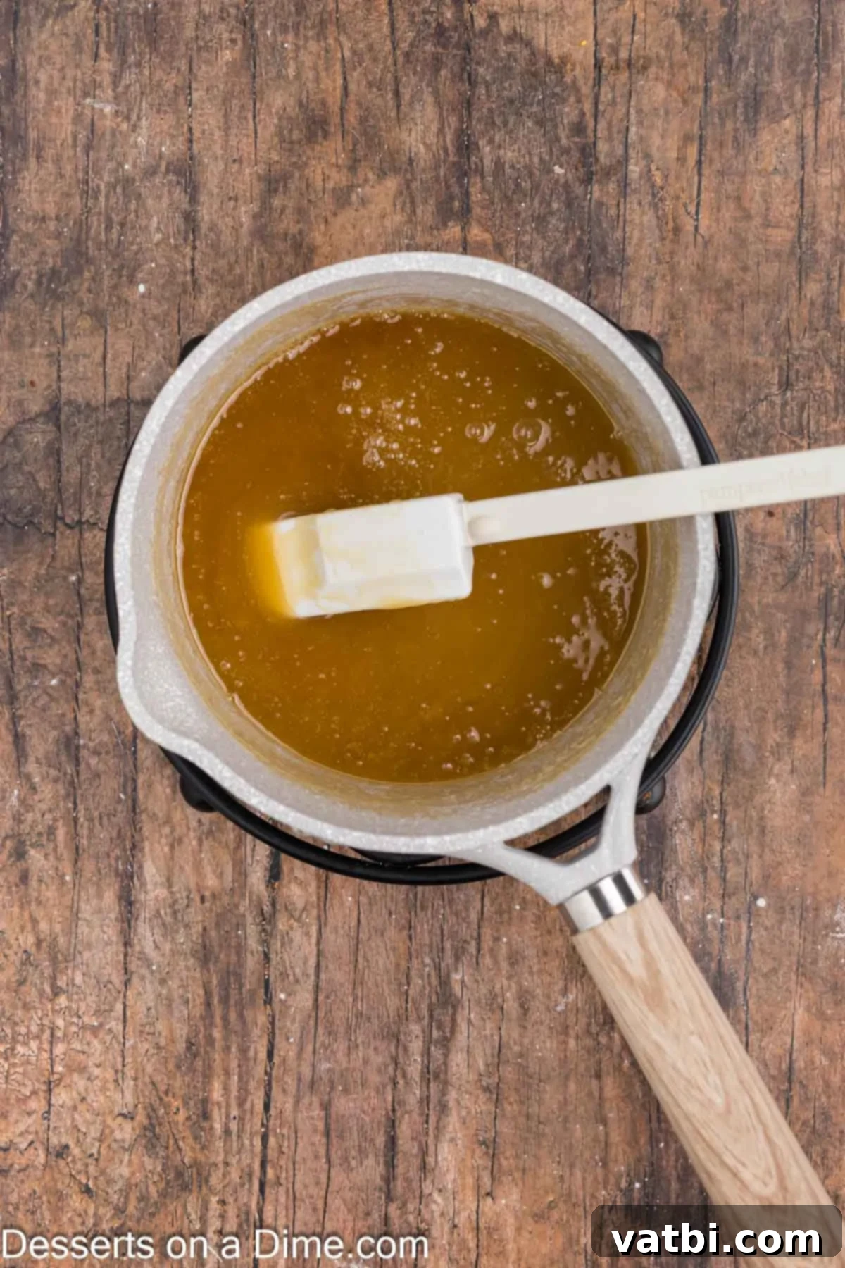 Magical Harry Potter Cupcakes 8 Butterscotch sauce boiling vigorously in a saucepan, reaching the right consistency.