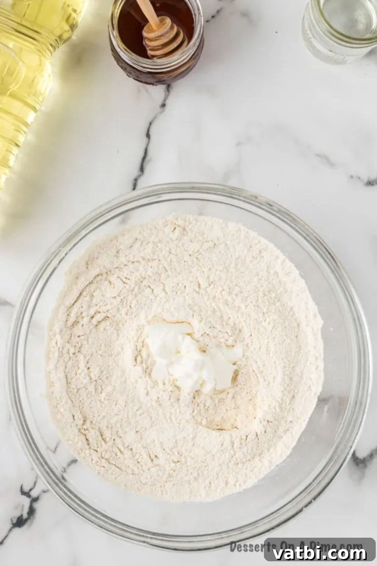 Golden & Fluffy Sopapillas: The Perfect Sweet Treat 5 Shortening added to bowl with dry ingredients.