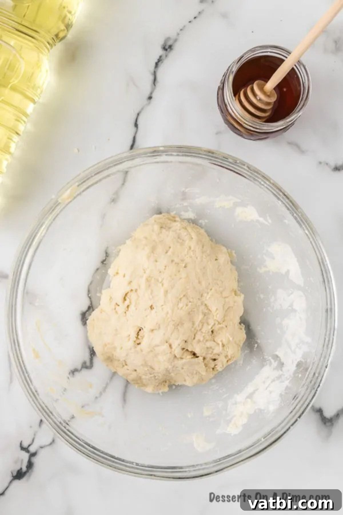 Golden & Fluffy Sopapillas: The Perfect Sweet Treat 7 Dough combined and kneaded together in a bowl.