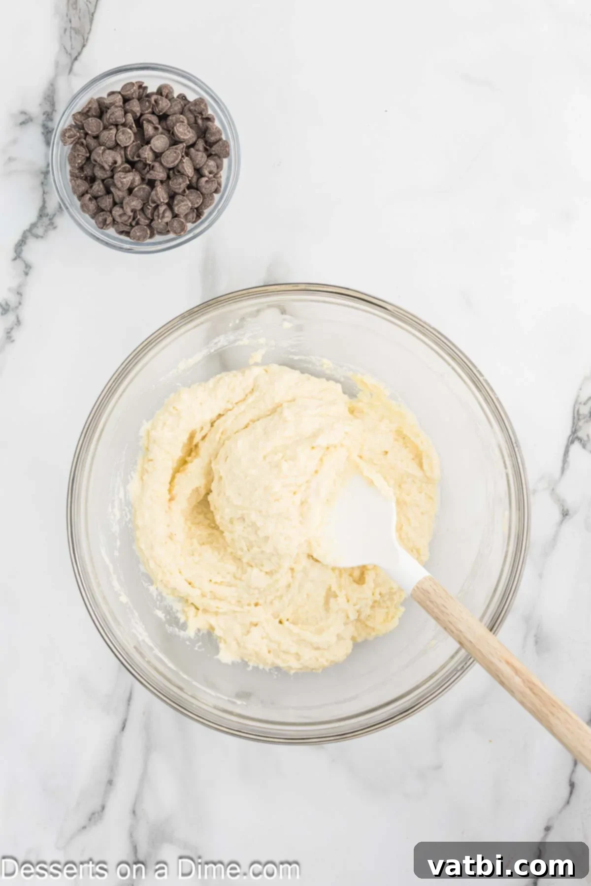 Wholesome Cottage Cheese Cookies 5 Almond flour being added to the smooth cottage cheese mixture in a mixing bowl.