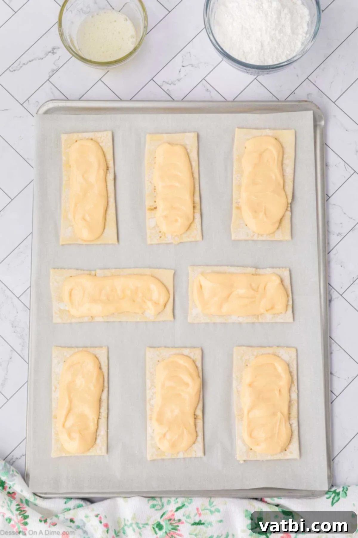 Heavenly Cream Cheese Danish 10 Cream cheese filling on baking sheet.