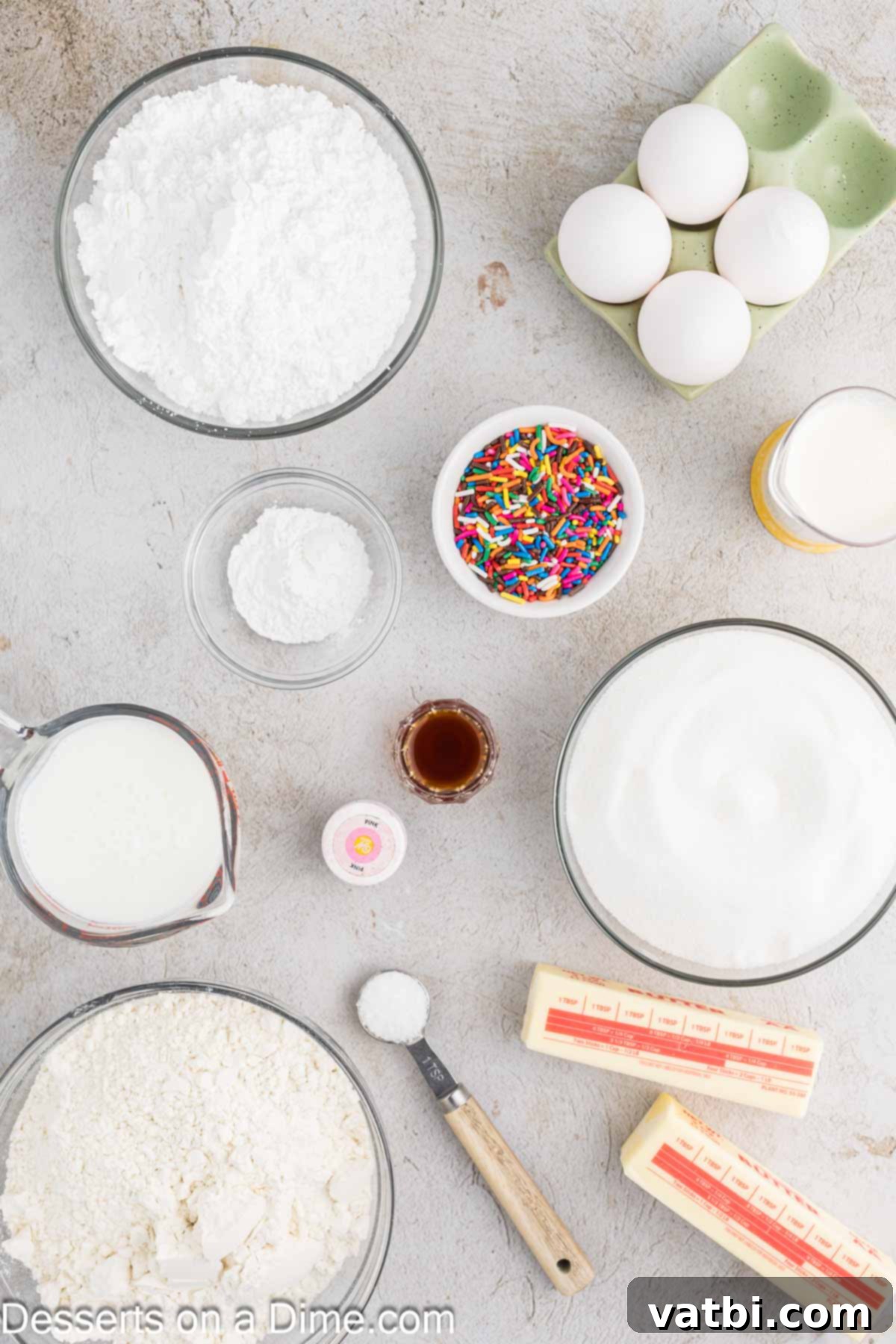 Donut Cake Delight 3 Collection of fresh ingredients for baking a donut cake: softened butter, large eggs, vanilla extract, cake flour, buttermilk, granulated sugar, baking powder, salt for the cake; powdered sugar, heavy cream, food coloring, and colorful sprinkles for the glaze.