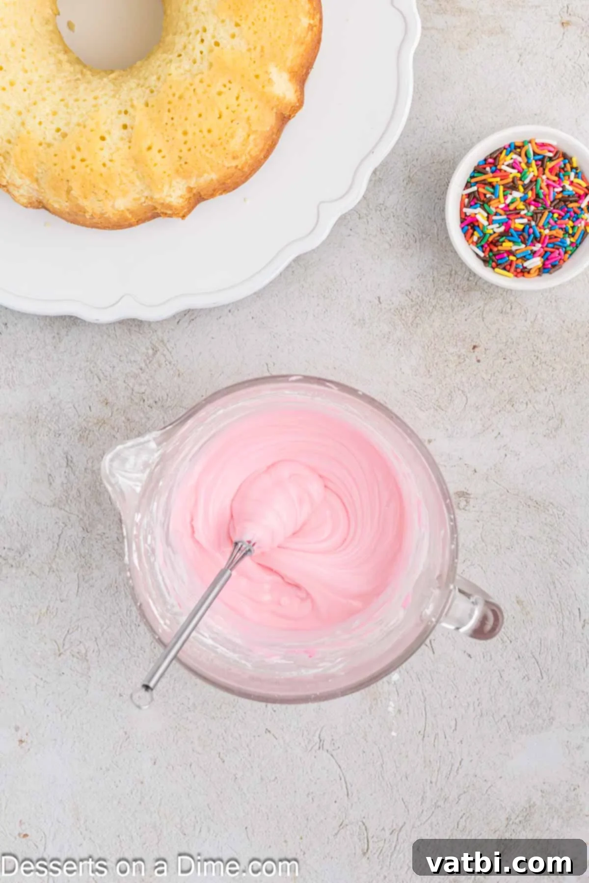 Donut Cake Delight 8 Powdered sugar and heavy cream being whisked together in a small mixing bowl to create a smooth, pourable glaze.