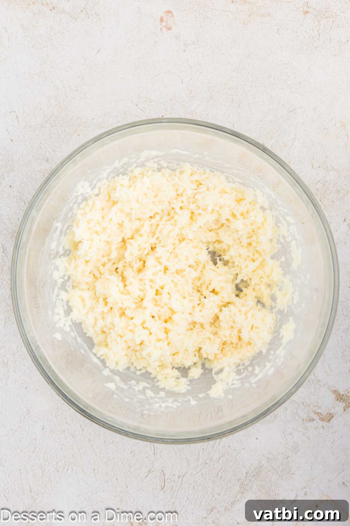 Chewy Coconut Macaroons 4 Shredded coconut and sweetened condensed milk combined in a bowl.