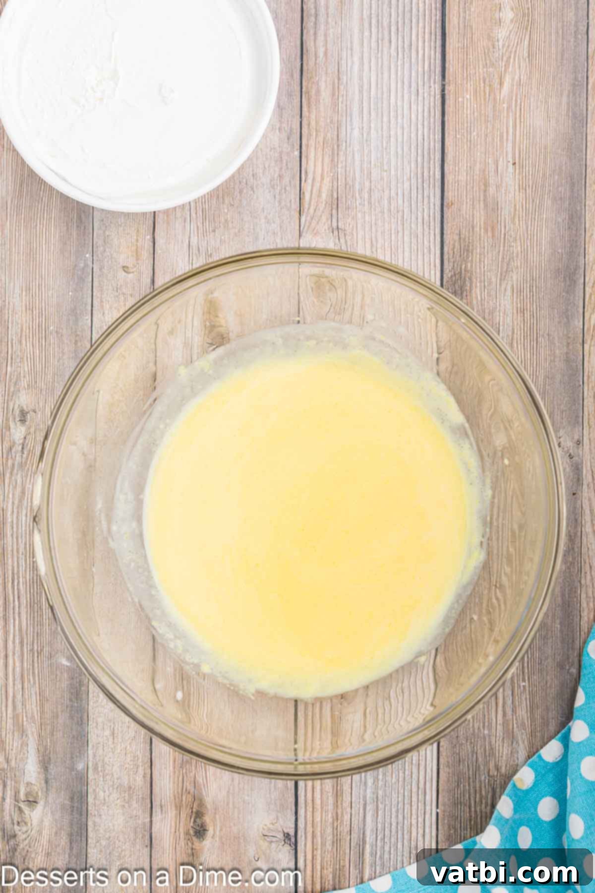 Orange Creamsicle Cake 4 Cake batter combined in a mixing bowl, ready for baking.