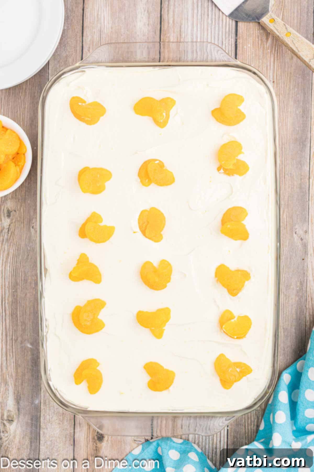 Orange Creamsicle Cake 10 Orange Creamsicle Cake frosted with creamy topping and garnished with fresh mandarin orange slices.