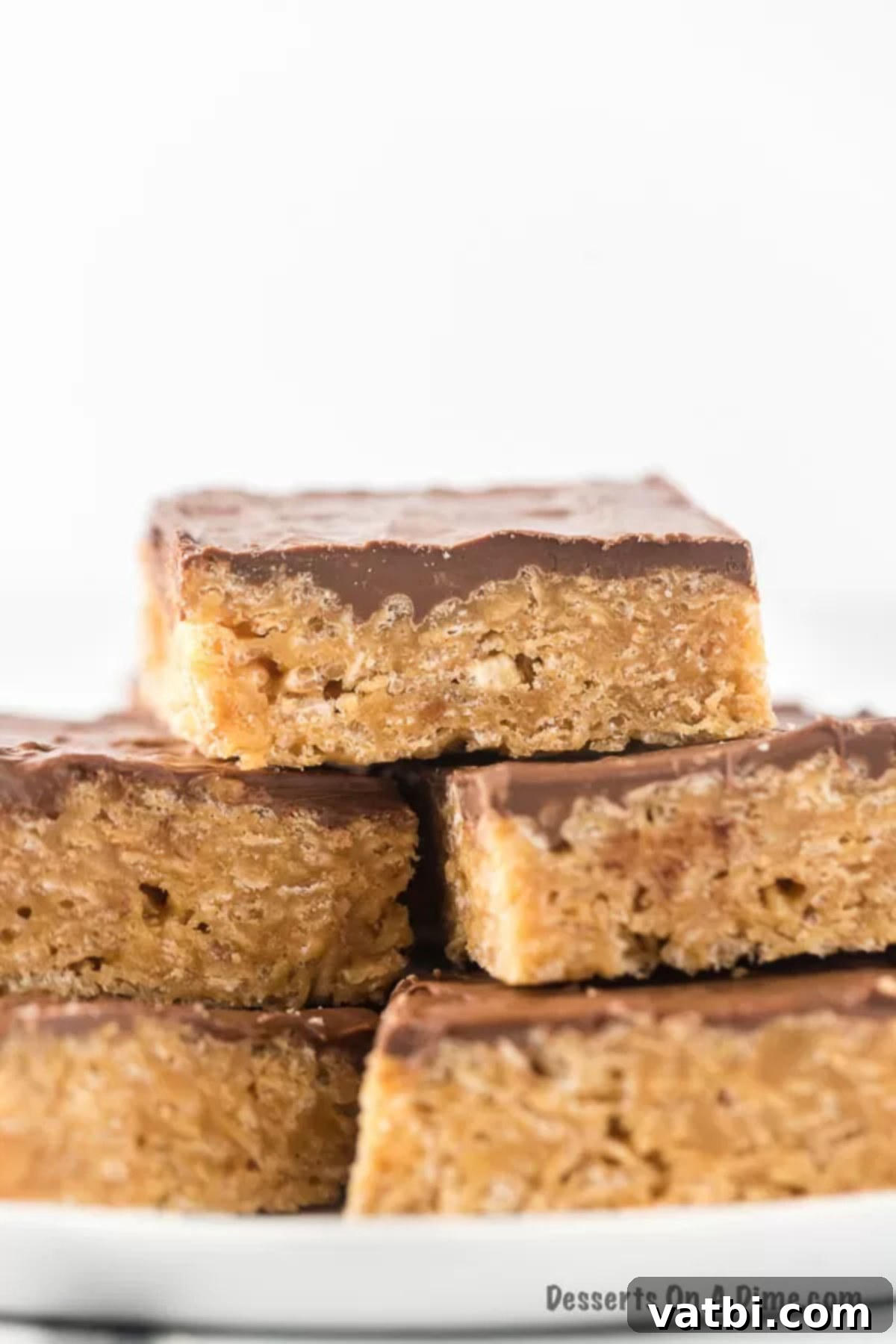 A platter featuring beautifully cut and arranged Scotcheroos bars, ready for serving.