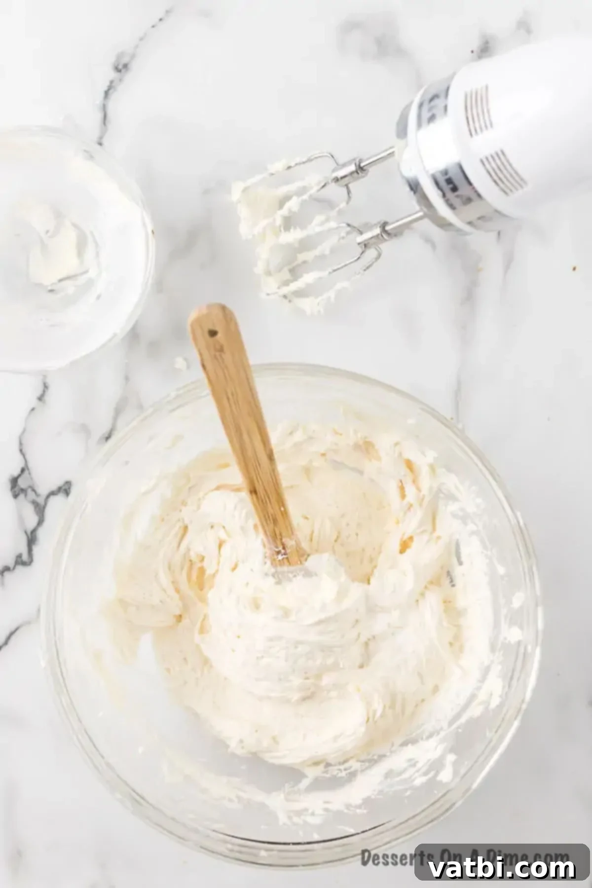 Combine softened butter and sifted powdered sugar in a large bowl, ready for beating.