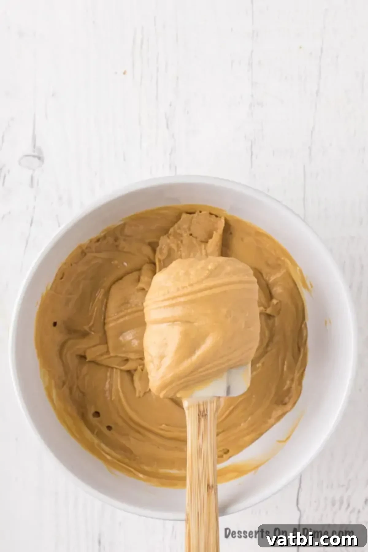Easy 3-Ingredient Peanut Butter Fudge 8 Close-up of the spatula ensuring the peanut butter fudge mixture is perfectly combined.