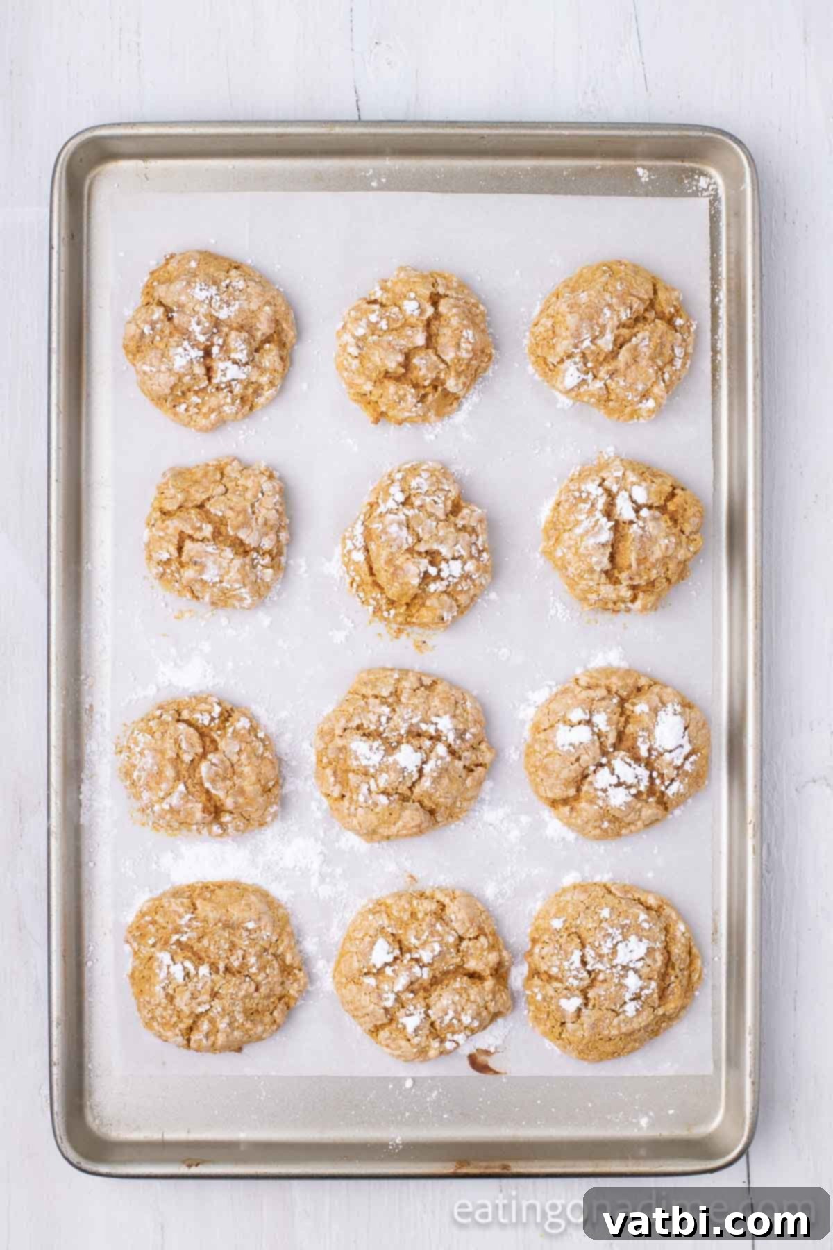 Cookies baked and cooling on baking sheet. 