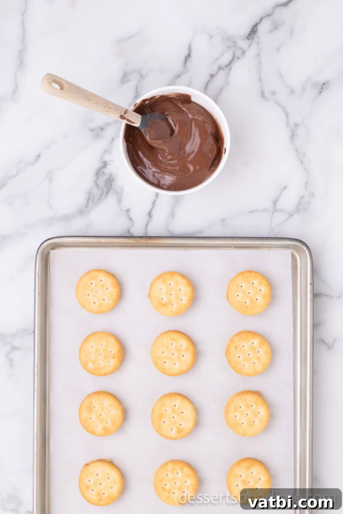 Sweet and Salty Chocolate Ritz Bites 5 Smooth milk chocolate, perfectly melted and glossy, resting in a microwave-safe bowl, ready for dipping.