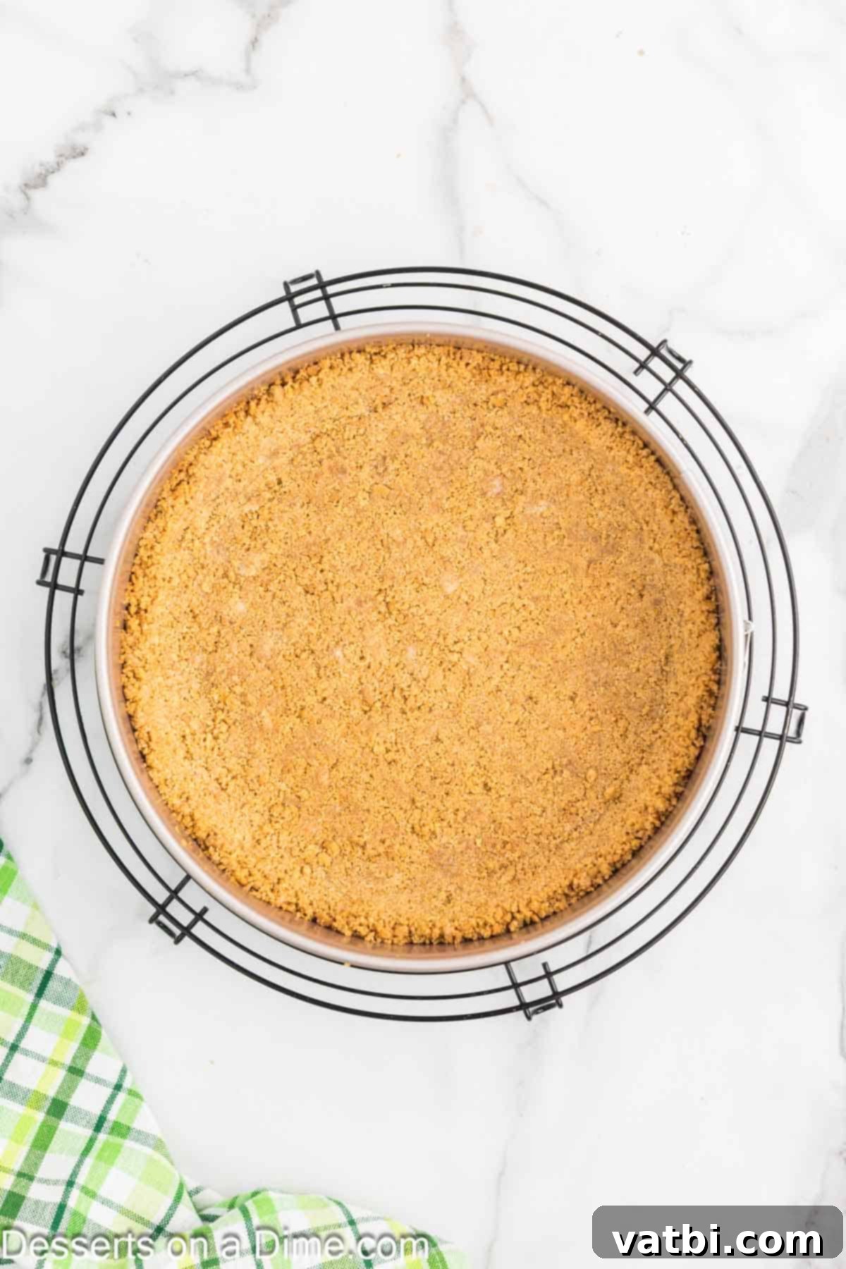 Key Lime Cheesecake 4 Graham cracker crust cooling in a springform pan.