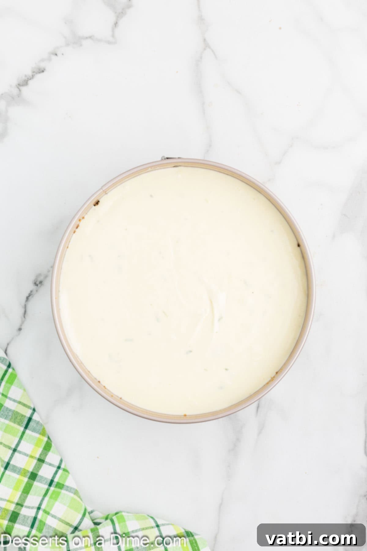 Key Lime Cheesecake 6 Cream cheese filling poured into the springform pan with the crust.