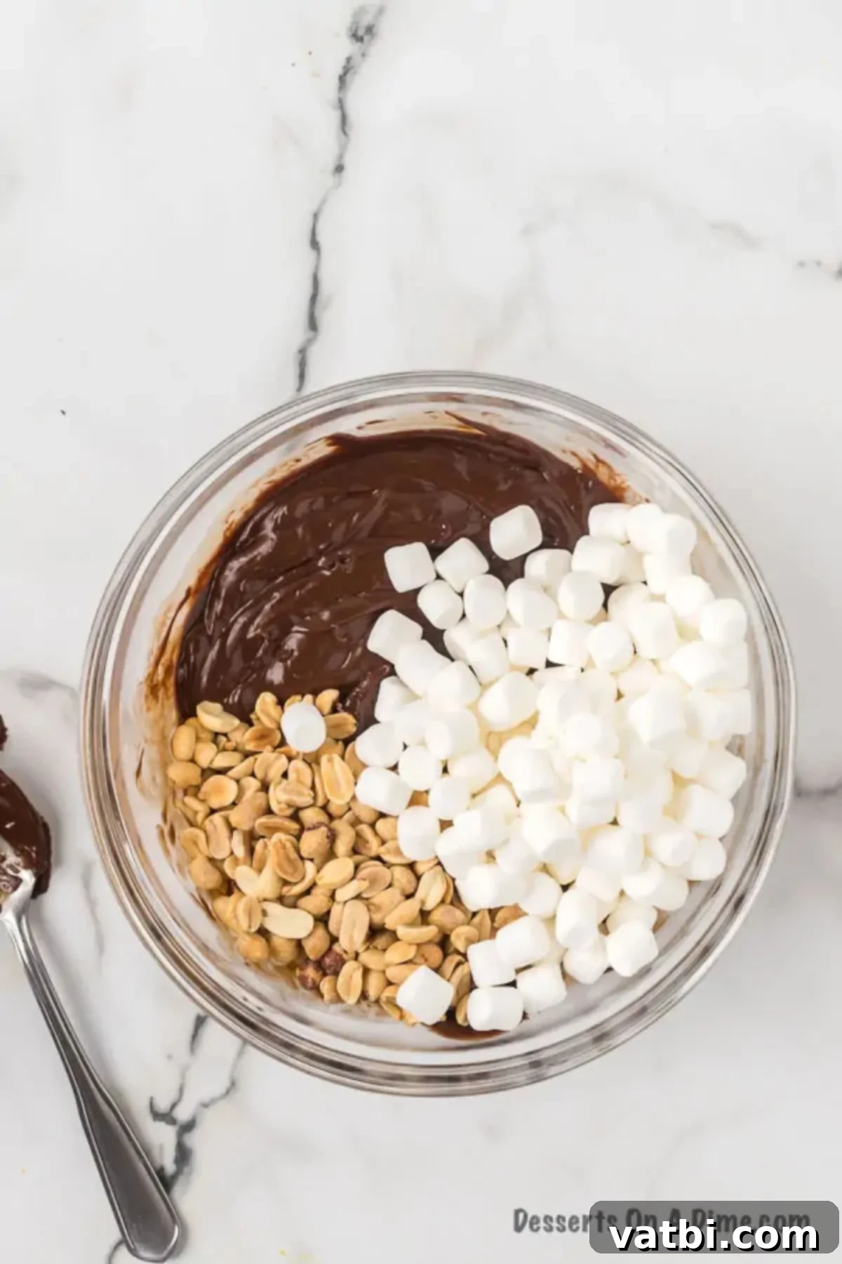 Marshmallows and nuts folded into mixture. 
