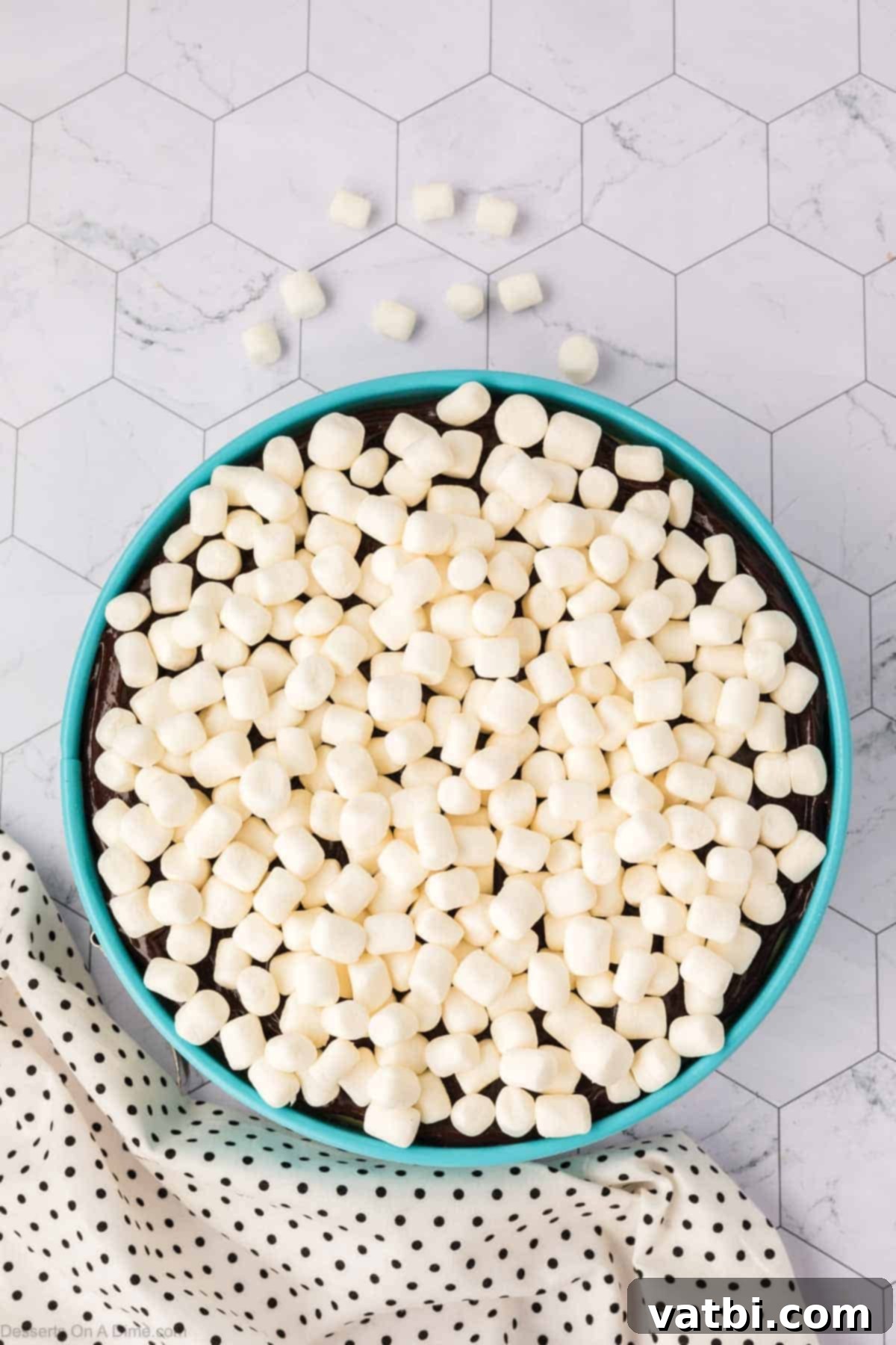 Smores Cheesecake 13 Mini marshmallows generously sprinkled on top of the hot fudge layer.