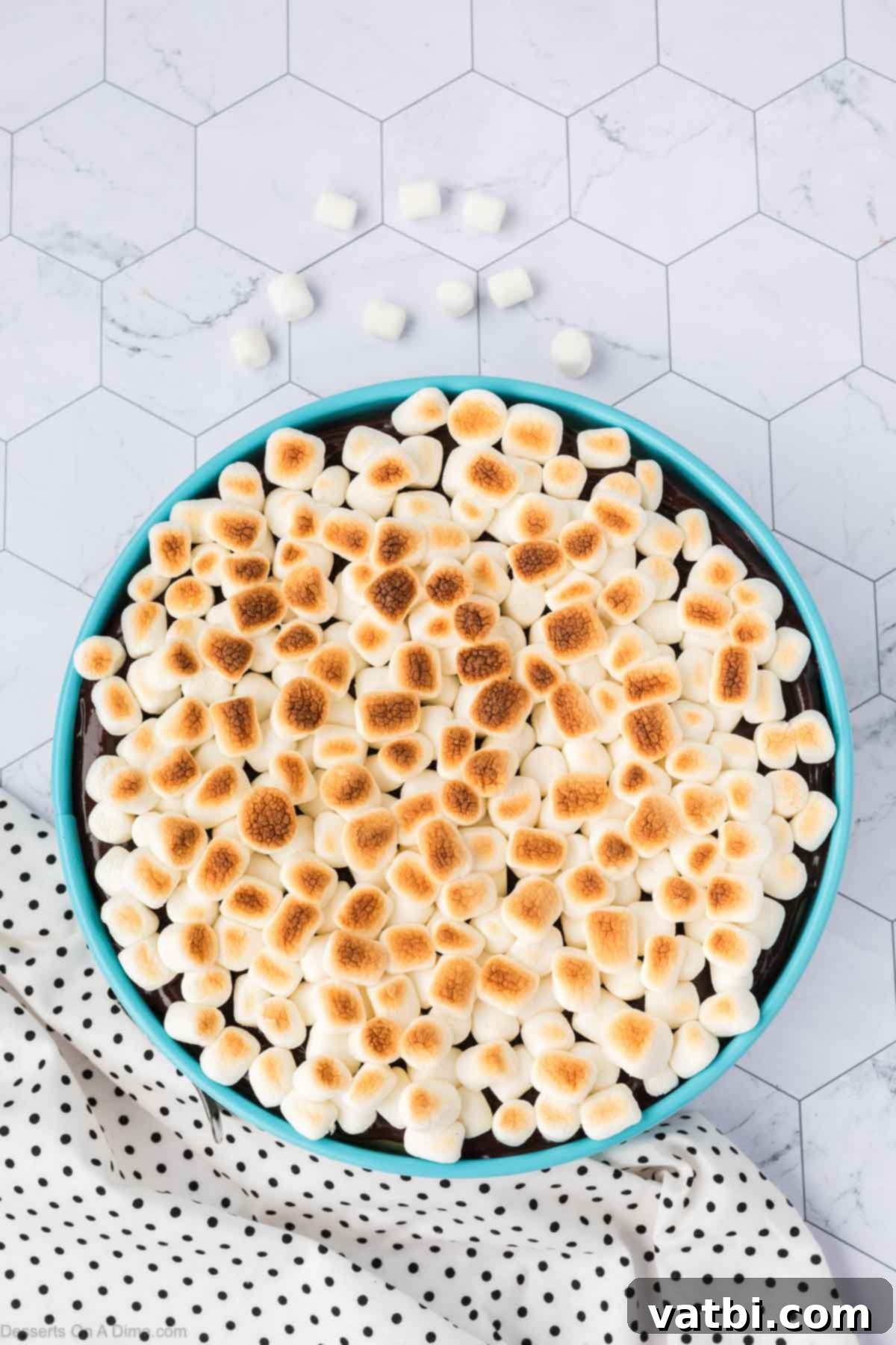Smores Cheesecake 14 Mini marshmallows broiled to a golden brown on top of the cheesecake.