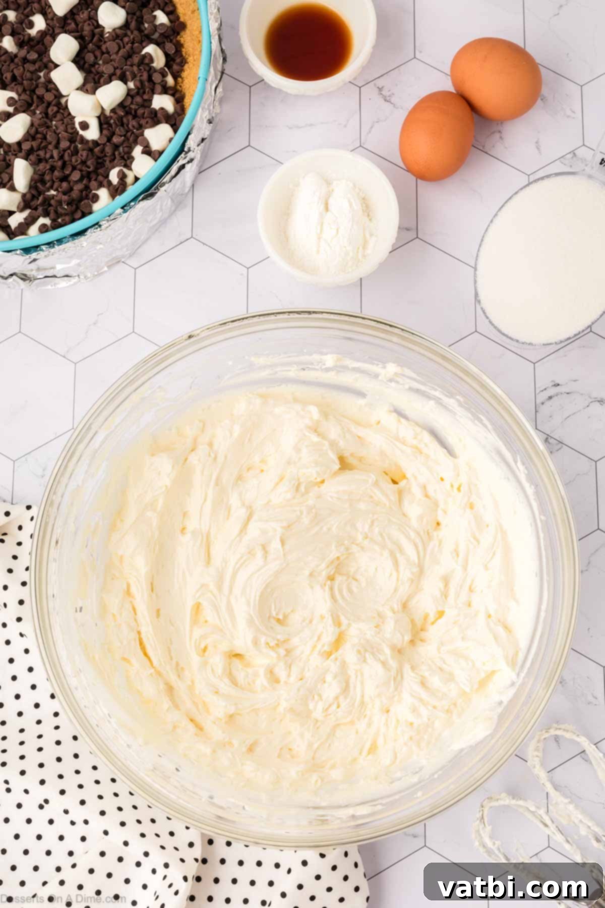 Smores Cheesecake 8 Cream cheese beaten until light and fluffy in a mixing bowl.
