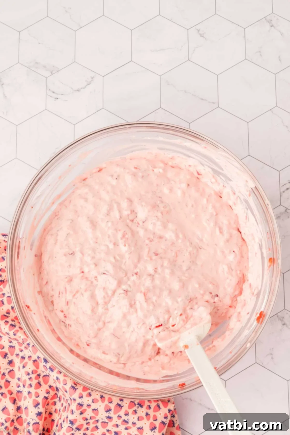 The fully combined cheesecake fluff mixture in a bowl, ready for chilling before serving.