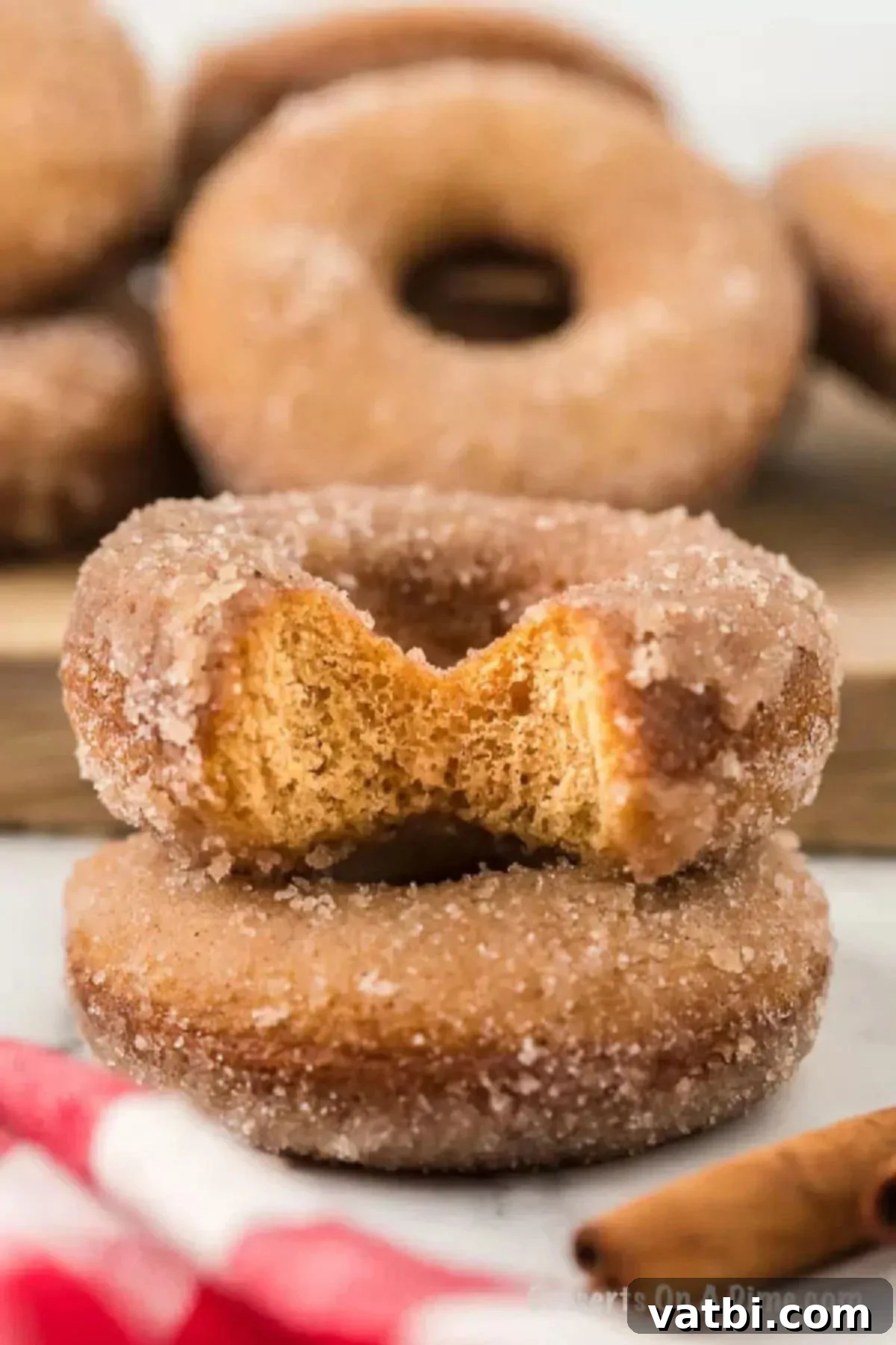 Spiced Apple Cider Baked Doughnuts 2 Apple Donuts stacked together.
