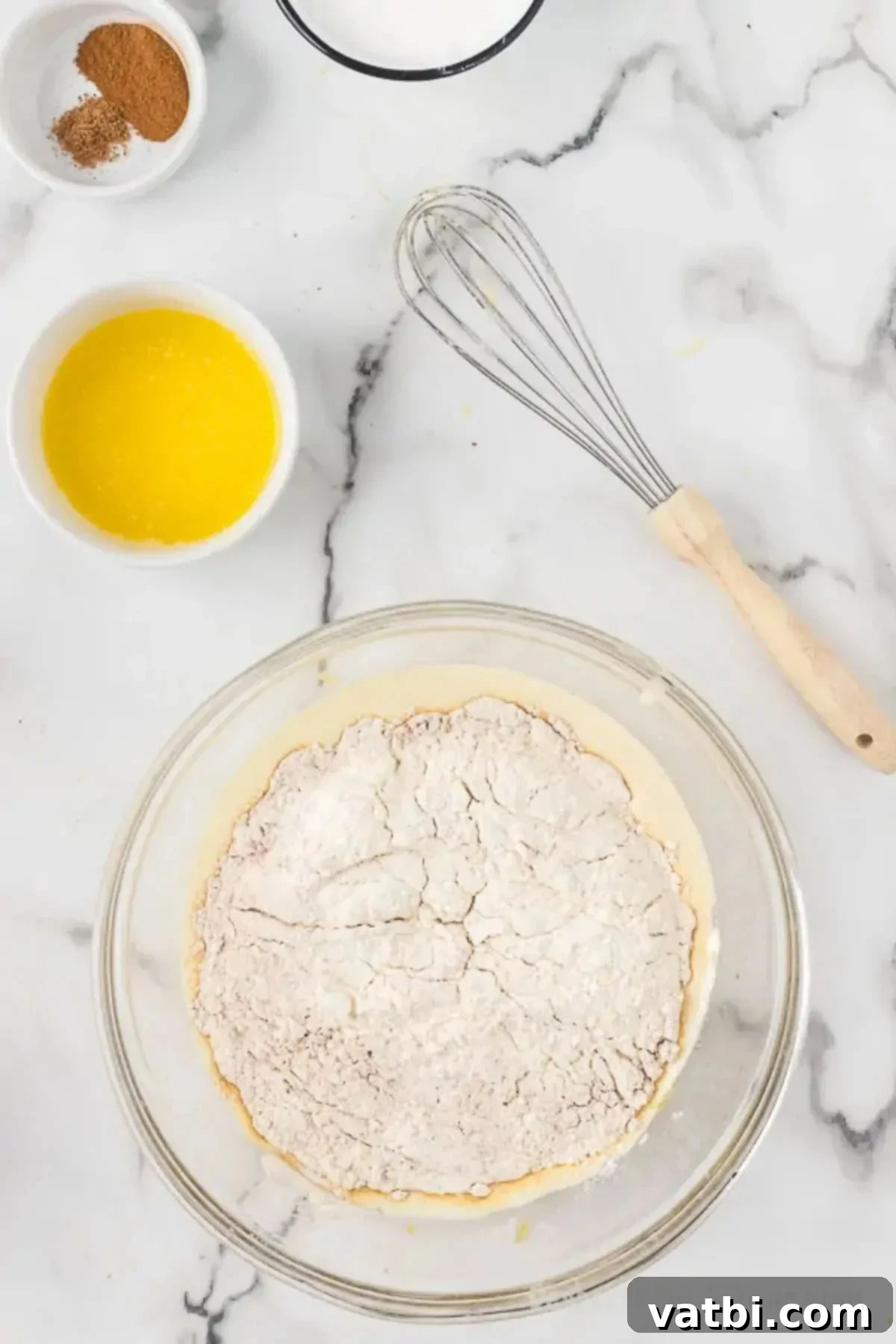 Spiced Apple Cider Baked Doughnuts 6 Dry ingredients added to wet ingredients.