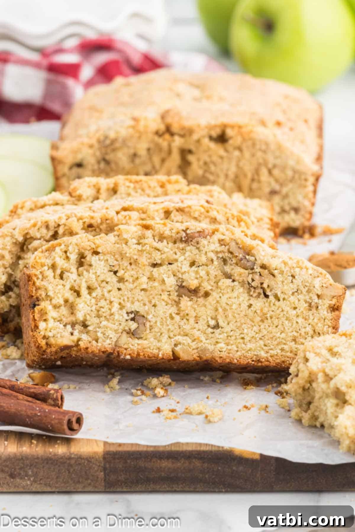Spiced Apple Loaf 10 A perfectly baked and sliced apple bread loaf, ready to be enjoyed with a hot beverage.