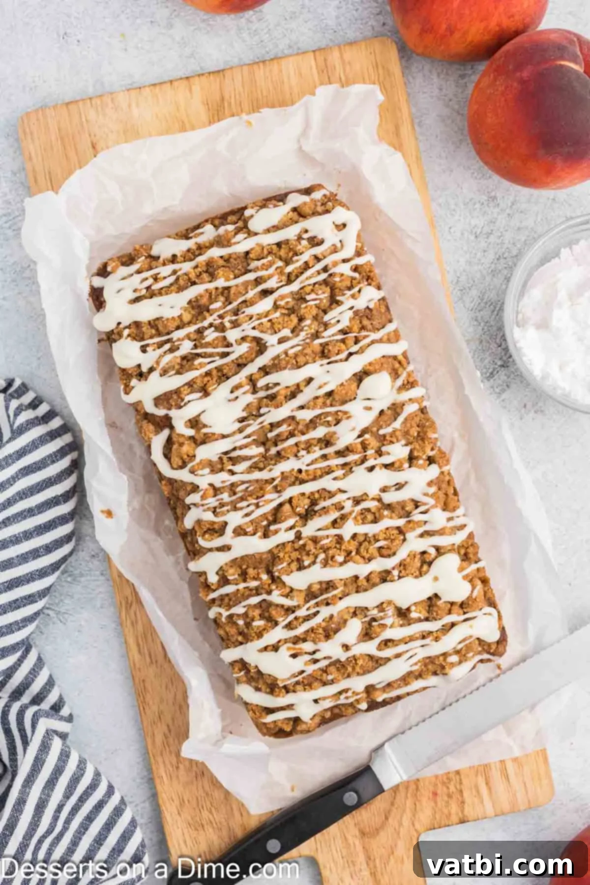Glaze spread on top of cooled Peach Bread, glistening and ready to serve.