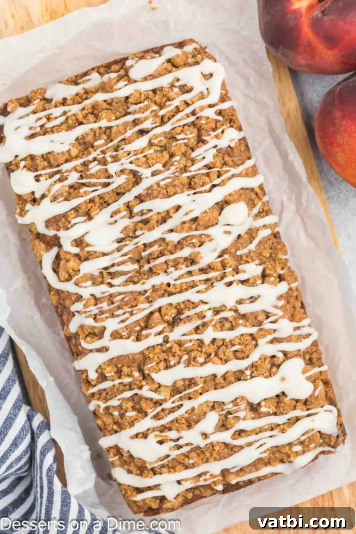 Peach Bread topped with glaze ready to serve, a beautiful summer dessert.