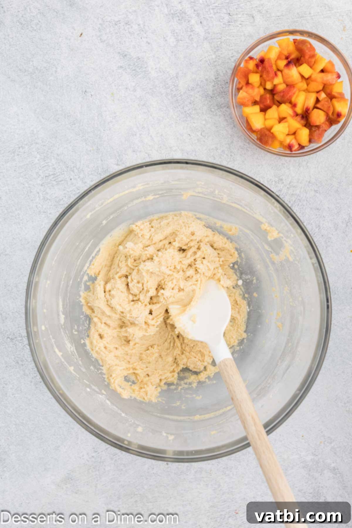 Wet ingredients combined in separate bowl, showcasing a light and fluffy mixture.