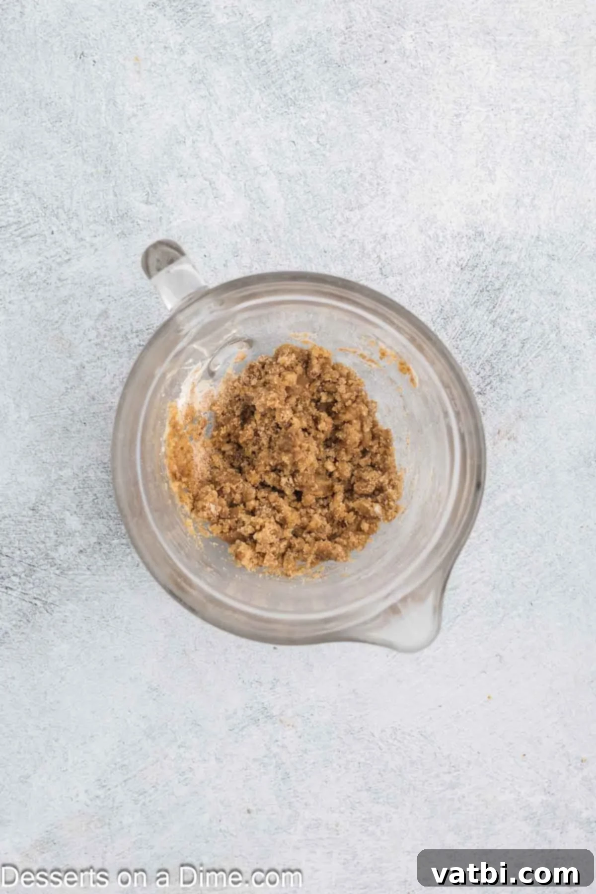 Streusel topping ingredients combined in a bowl, showing crumbly texture.