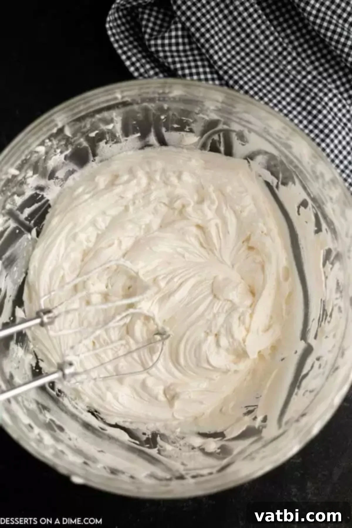 Spooky Halloween Dirt Cake 7 The smooth and creamy cream cheese, butter, powdered sugar, and Cool Whip mixture in a bowl, after being perfectly combined.