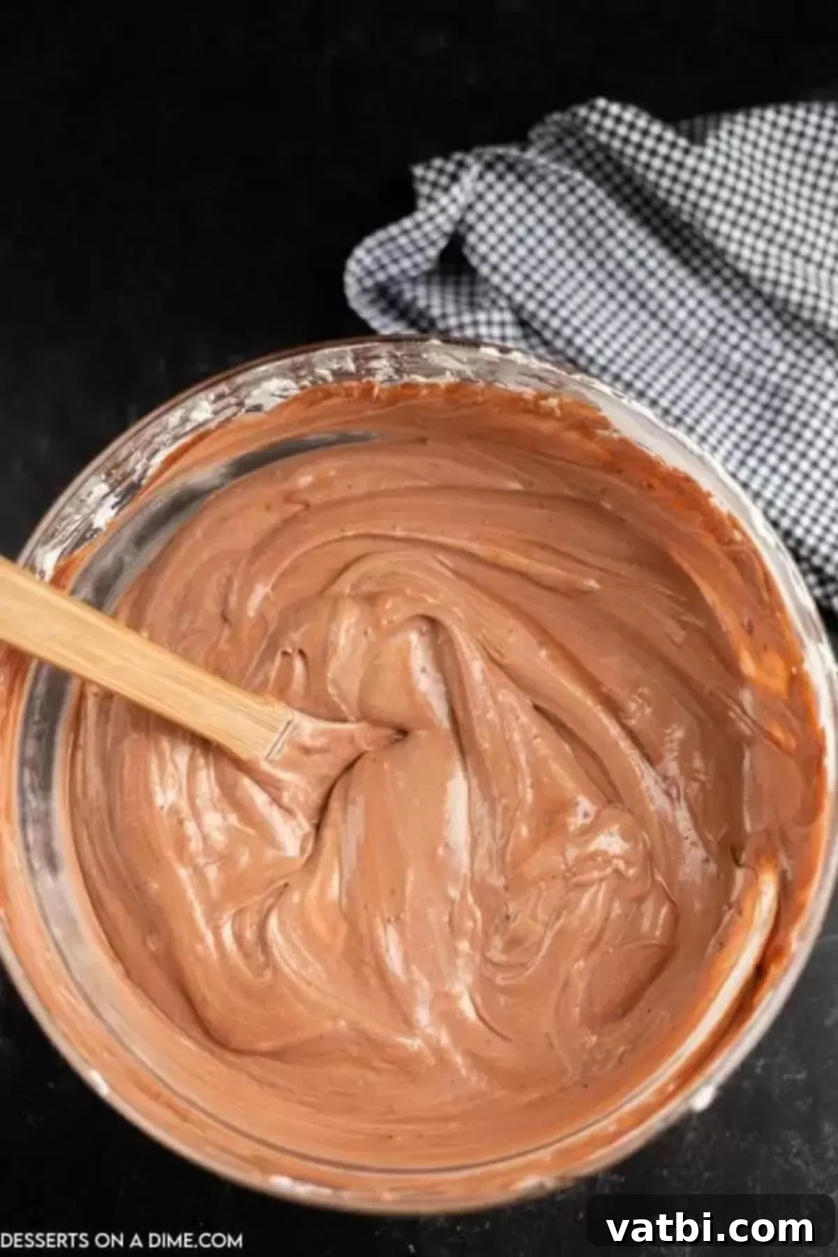 Spooky Halloween Dirt Cake 8 The chocolate pudding mixture, thick and smooth, combined in a separate bowl and ready to be folded into the cream cheese mixture.