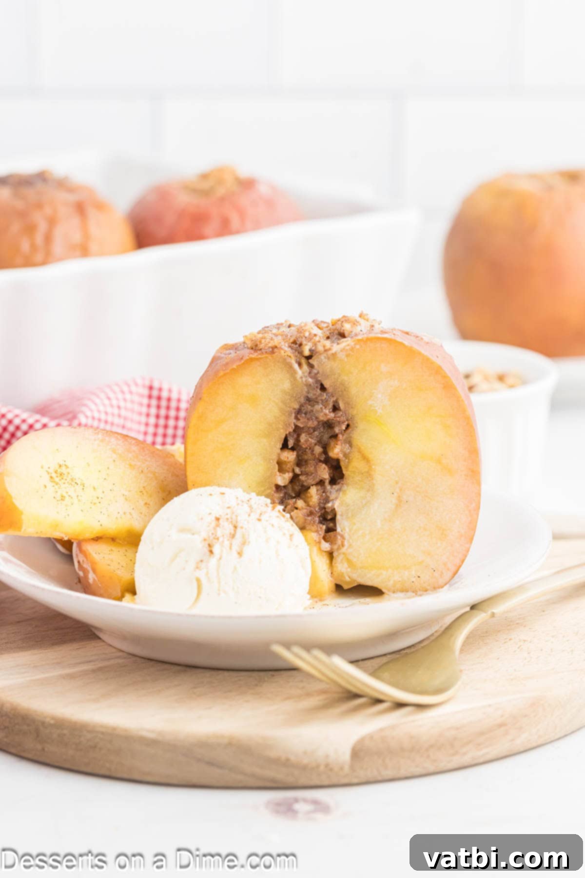 Warm Spiced Baked Apples 7 A single perfectly baked apple on a clean white plate, with a scoop of creamy vanilla ice cream melting gently on its top, and a touch of golden syrup around the base.