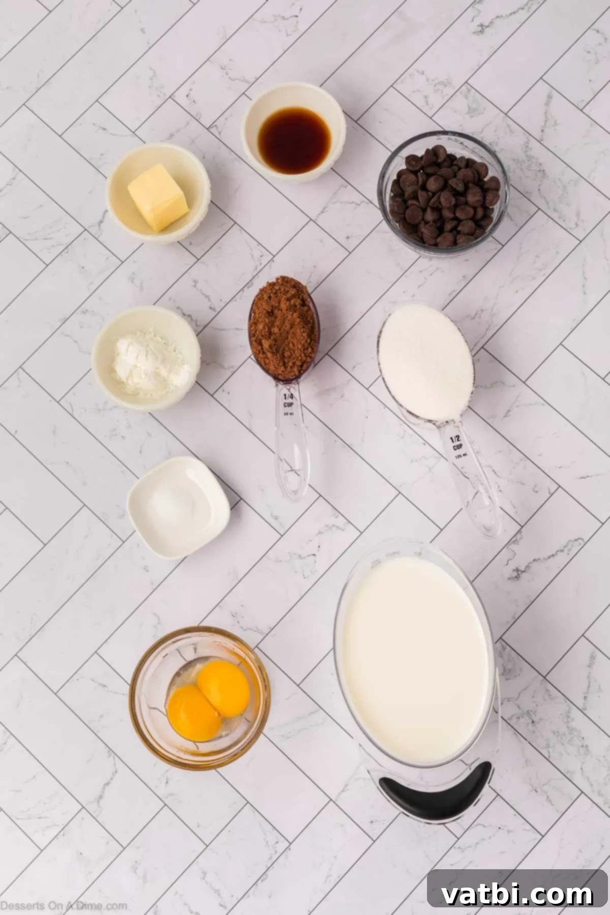 Deep Dark Chocolate Pudding 3 Ingredients for recipe - egg yolks, milk, sugar, cocoa powder, cornstarch, salt, vanilla, chocolate chips, butter.