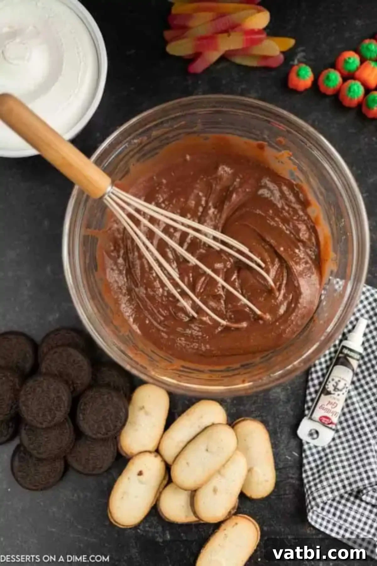 Spooky Halloween Dirt Cups 4 Chocolate pudding being whisked in a bowl.