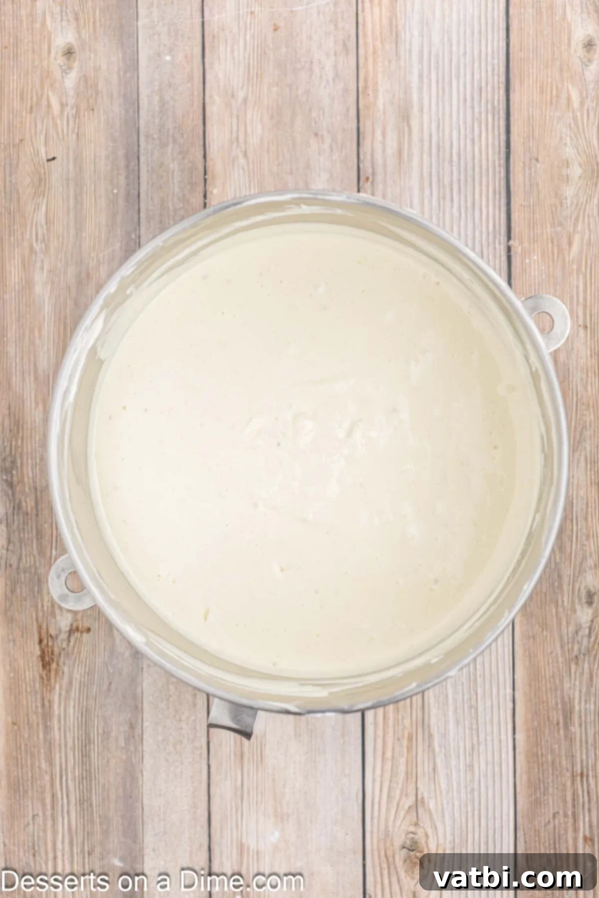 Decadent Banana Cheesecake 8 Cheesecake filling fully combined in a mixing bowl with all ingredients.
