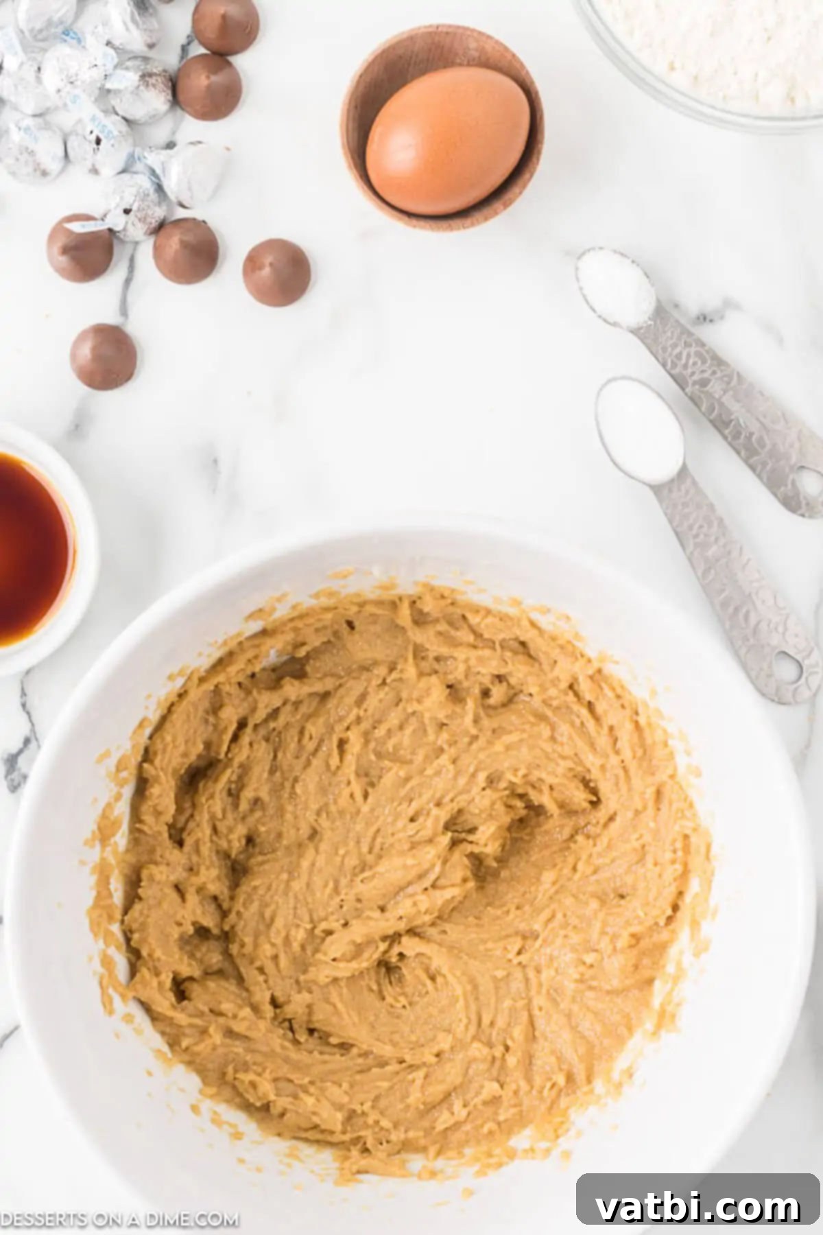 Chocolate-Kissed Peanut Butter Delights 3 Combining the peanut butter, sugar, and brown sugar together in a mixing bowl.