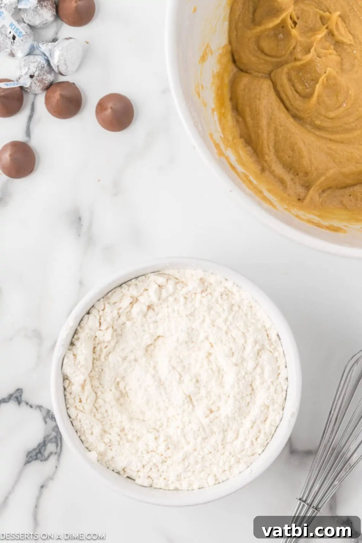 Chocolate-Kissed Peanut Butter Delights 5 Combining the dry ingredients (flour, baking soda, salt) in a separate bowl.