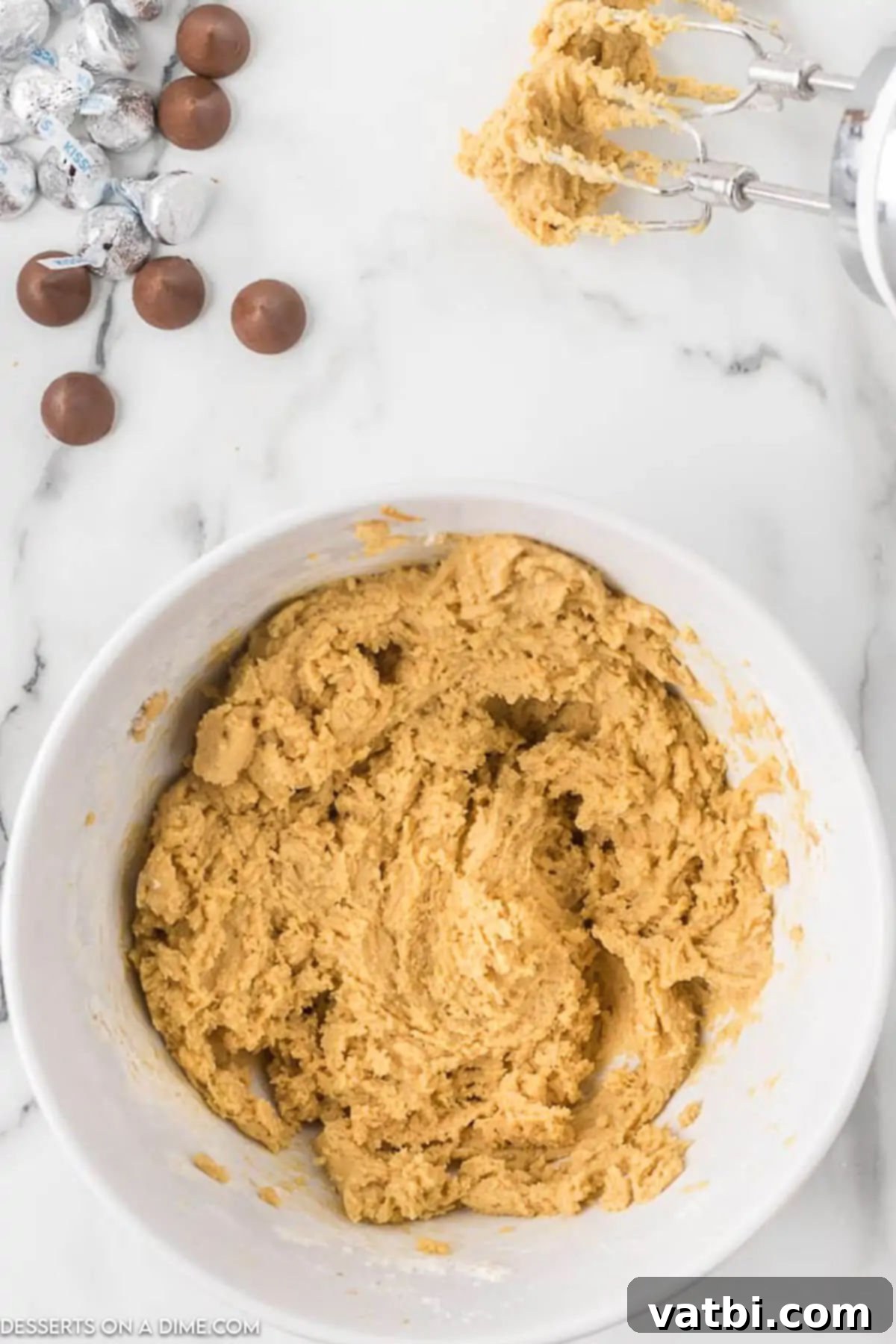 Chocolate-Kissed Peanut Butter Delights 6 Combining the dry and peanut butter mixture in a large mixing bowl.