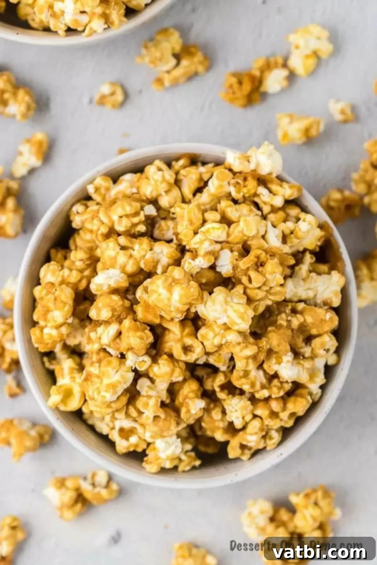 Ultimate Caramel Popcorn 2 Bowl of golden, crispy caramel popcorn.