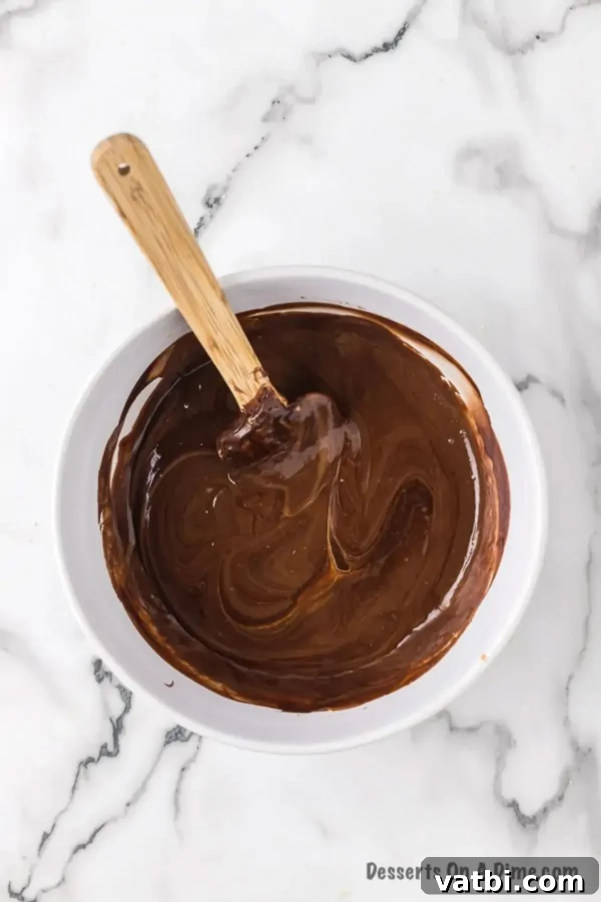 Rich and Creamy Chocolate Peanut Butter Fudge 5 Bowl with mixture combined.