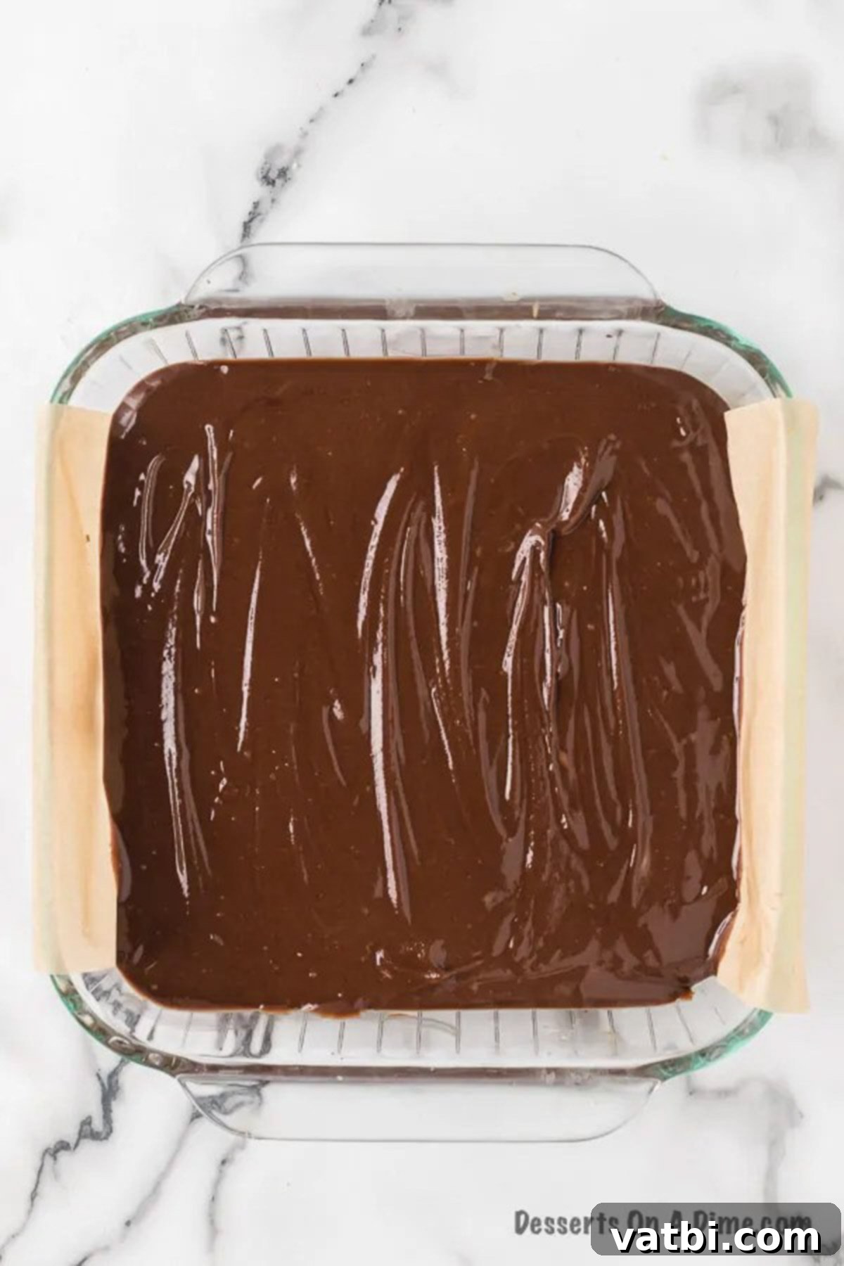 Rich and Creamy Chocolate Peanut Butter Fudge 6 Chocolate peanut butter fudge in pan starting to harden.
