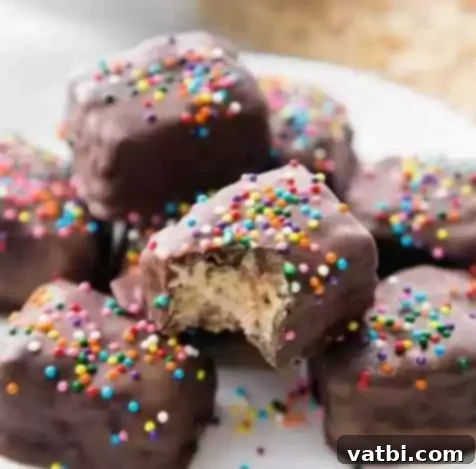 60 Festive and Simple Christmas Sweets 13 Festive Chocolate Covered Rice Krispie Treats with sprinkles.
