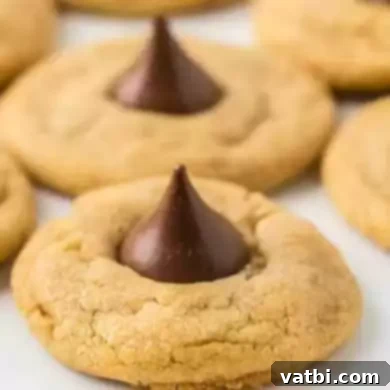 60 Festive and Simple Christmas Sweets 3 Classic Peanut Butter Kiss Cookies with a chocolate kiss on top.