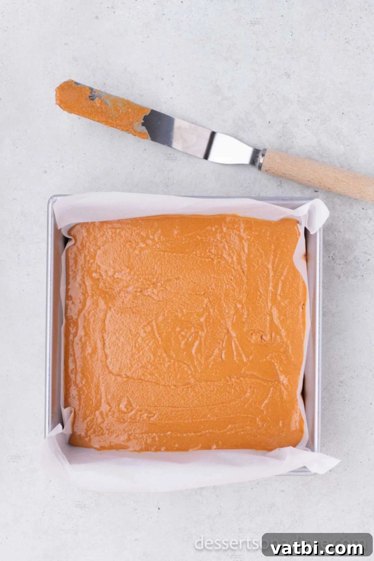 DIY Butterfinger Bars 5 Peanut butter and candy corn mixture spread evenly into the prepared baking dish.